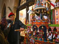 KRAKOW, POLAND - DECEMBER 05:
A contestant presents their handcrafted Nativity Scene at Krakow's Main Square during the 82nd Nativity Scene...