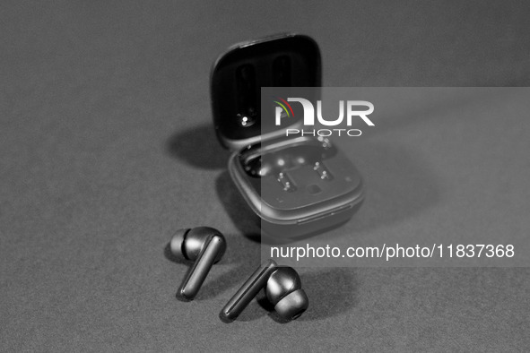 Black wireless headphones sit on a table in Athens, Greece, on December 5, 2024. (Photo Illustration  by Nikolas Kokovlis/NurPhoto)