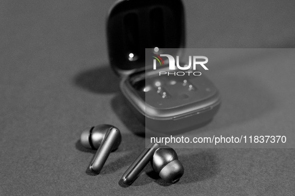 Black wireless headphones sit on a table in Athens, Greece, on December 5, 2024. (Photo Illustration  by Nikolas Kokovlis/NurPhoto)