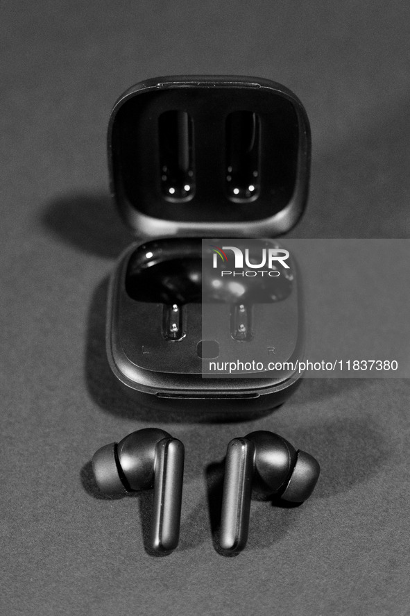 Black wireless headphones sit on a table in Athens, Greece, on December 5, 2024. (Photo Illustration  by Nikolas Kokovlis/NurPhoto)