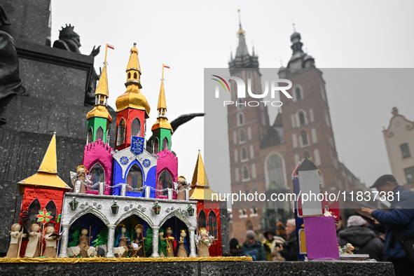 KRAKOW, POLAND - DECEMBER 05:
Contestants present their handcrafted Nativity Scenes at Krakow's Main Square during the 82nd Nativity Scene C...