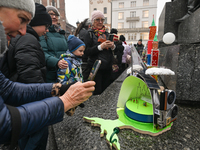 KRAKOW, POLAND - DECEMBER 05:
Visitors, tourists, and locals gather in Krakow's Main Square, capturing photos of the detailed handcrafted Na...