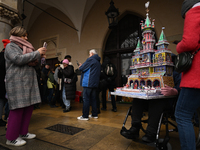 KRAKOW, POLAND - DECEMBER 05:
A contestant presents their handcrafted Nativity Scene at Krakow's Main Square during the 82nd Nativity Scene...