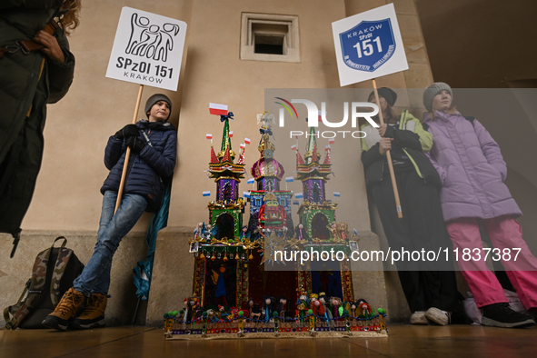 KRAKOW, POLAND - DECEMBER 05:
Contestants present their handcrafted Nativity Scene at Krakow's Main Square during the 82nd Nativity Scene Co...