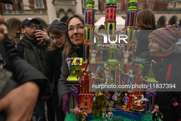 KRAKOW, POLAND - DECEMBER 05:
A contestant presents their handcrafted Nativity Scene at Krakow's Main Square during the 82nd Nativity Scene...