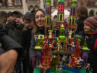 KRAKOW, POLAND - DECEMBER 05:
A contestant presents their handcrafted Nativity Scene at Krakow's Main Square during the 82nd Nativity Scene...