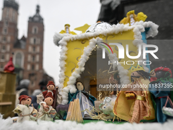 KRAKOW, POLAND - DECEMBER 05:
A contestant presents their handcrafted Nativity Scene at Krakow's Main Square during the 82nd Nativity Scene...