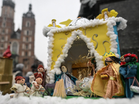 KRAKOW, POLAND - DECEMBER 05:
A contestant presents their handcrafted Nativity Scene at Krakow's Main Square during the 82nd Nativity Scene...