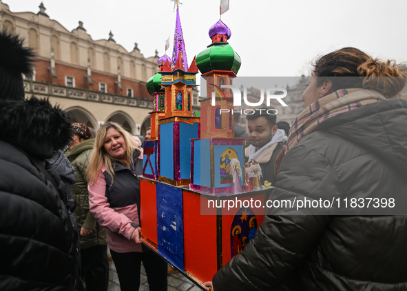 KRAKOW, POLAND - DECEMBER 05:
Contestants arrive with their handcrafted Nativity Scene at Krakow's Main Square during the 82nd Nativity Scen...