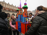 KRAKOW, POLAND - DECEMBER 05:
Contestants arrive with their handcrafted Nativity Scene at Krakow's Main Square during the 82nd Nativity Scen...