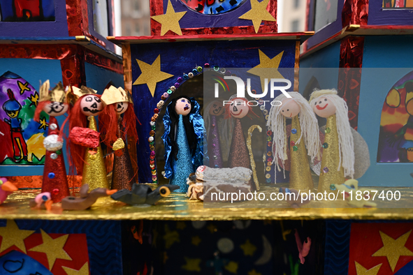 KRAKOW, POLAND - DECEMBER 05:
A contestant presents their handcrafted Nativity Scene at Krakow's Main Square during the 82nd Nativity Scene...