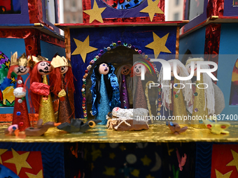 KRAKOW, POLAND - DECEMBER 05:
A contestant presents their handcrafted Nativity Scene at Krakow's Main Square during the 82nd Nativity Scene...