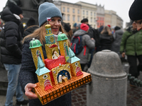 KRAKOW, POLAND - DECEMBER 05:
A contestant presents their handcrafted Nativity Scene at Krakow's Main Square during the 82nd Nativity Scene...