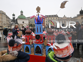 KRAKOW, POLAND - DECEMBER 05:
A group of young contestants from kindergarten number 95 presents their handcrafted Nativity Scene at Krakow's...