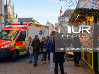 An ambulance provides rescue service at the Christmas market on Marienplatz in Munich, Germany, on December 5, 2024. (