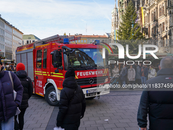 A fire engine is at the Christmas market on Marienplatz in Munich, Germany, on December 5, 2024. (