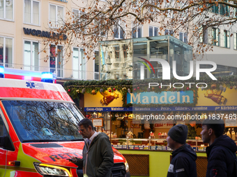 An ambulance provides rescue service at the Christmas market on Marienplatz in Munich, Germany, on December 5, 2024. (