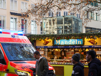 An ambulance provides rescue service at the Christmas market on Marienplatz in Munich, Germany, on December 5, 2024. (