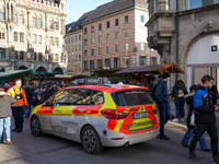 An emergency doctor vehicle is at the Christmas market on Marienplatz in Munich. (