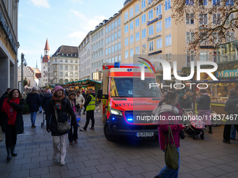 An ambulance provides rescue service at the Christmas market on Marienplatz in Munich, Germany, on December 5, 2024. (