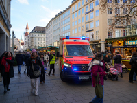 An ambulance provides rescue service at the Christmas market on Marienplatz in Munich, Germany, on December 5, 2024. (