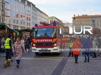 A fire engine is at the Christmas market on Marienplatz in Munich, Germany, on December 5, 2024. (