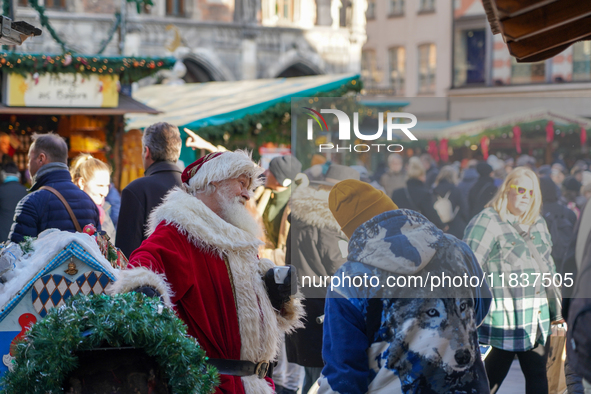 Santa Claus is at the Christmas market on Marienplatz in Munich, Germany, on December 5, 2024. 