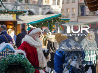 Santa Claus is at the Christmas market on Marienplatz in Munich, Germany, on December 5, 2024. (