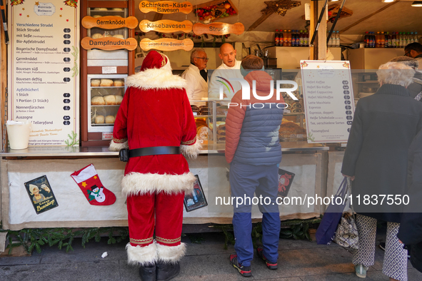 People are at the Christmas market on Marienplatz in Munich, Germany, on December 5, 2024. 