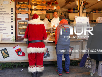 People are at the Christmas market on Marienplatz in Munich, Germany, on December 5, 2024. (