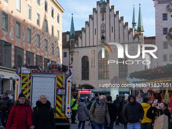 People are at the Christmas market on Marienplatz in Munich, Germany, on December 5, 2024. (