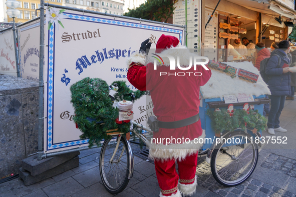 People are at the Christmas market on Marienplatz in Munich, Germany, on December 5, 2024. 