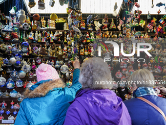 People are at the Christmas market on Marienplatz in Munich, Germany, on December 5, 2024. (