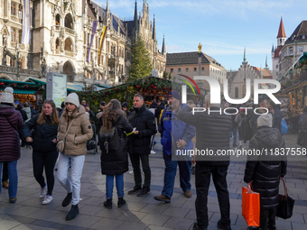 People are at the Christmas market on Marienplatz in Munich, Germany, on December 5, 2024. (