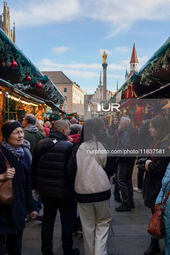 People are at the Christmas market on Marienplatz in Munich, Germany, on December 5, 2024. 