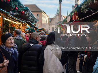 People are at the Christmas market on Marienplatz in Munich, Germany, on December 5, 2024. (