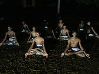 Angampora students attend meditations before starting Angampora lessons in Eheliyagoda, Sri Lanka, on December 5, 2024. Angampora is a 3,000...