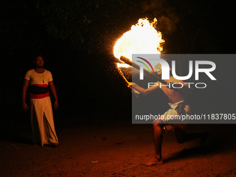 Angampora students perform their skills using fire and swords in Eheliyagoda, Sri Lanka, on December 5, 2024. Angampora is a 3,000-year-old...