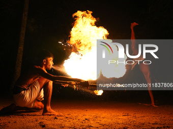 Angampora students perform their skills using fire and swords in Eheliyagoda, Sri Lanka, on December 5, 2024. Angampora is a 3,000-year-old...