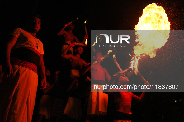 Angampora students perform their skills using fire in Eheliyagoda, Sri Lanka, on December 5, 2024. Angampora is a 3,000-year-old martial art...