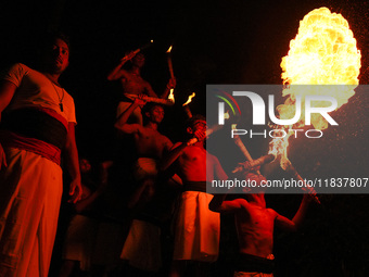 Angampora students perform their skills using fire in Eheliyagoda, Sri Lanka, on December 5, 2024. Angampora is a 3,000-year-old martial art...