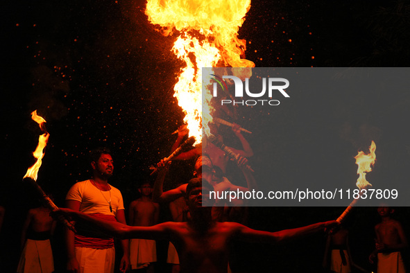 Angampora students perform their skills using fire in Eheliyagoda, Sri Lanka, on December 5, 2024. Angampora is a 3,000-year-old martial art...