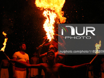 Angampora students perform their skills using fire in Eheliyagoda, Sri Lanka, on December 5, 2024. Angampora is a 3,000-year-old martial art...