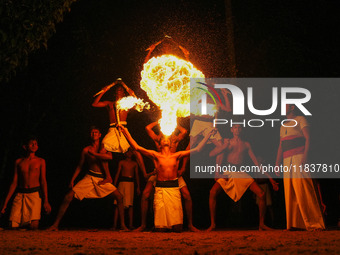 Angampora students perform their skills using fire in Eheliyagoda, Sri Lanka, on December 5, 2024. Angampora is a 3,000-year-old martial art...