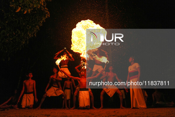 Angampora students perform their skills using fire in Eheliyagoda, Sri Lanka, on December 5, 2024. Angampora is a 3,000-year-old martial art...