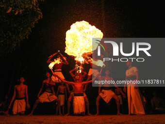 Angampora students perform their skills using fire in Eheliyagoda, Sri Lanka, on December 5, 2024. Angampora is a 3,000-year-old martial art...