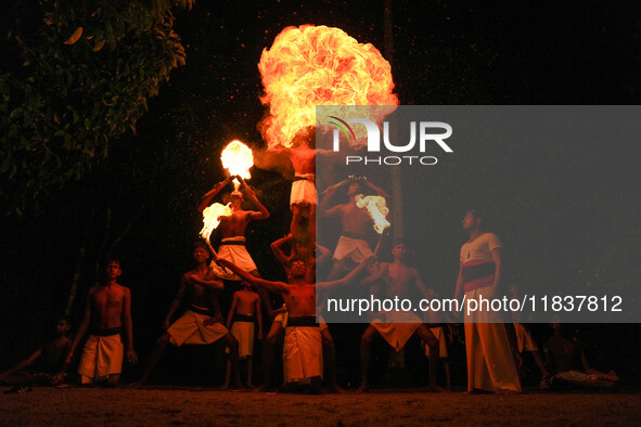 Angampora students perform their skills using fire in Eheliyagoda, Sri Lanka, on December 5, 2024. Angampora is a 3,000-year-old martial art...