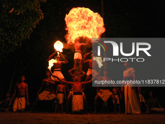 Angampora students perform their skills using fire in Eheliyagoda, Sri Lanka, on December 5, 2024. Angampora is a 3,000-year-old martial art...