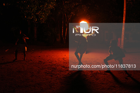 Angampora students perform their skills using fire and swords in Eheliyagoda, Sri Lanka, on December 5, 2024. Angampora is a 3,000-year-old...