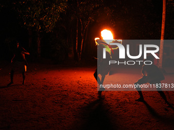 Angampora students perform their skills using fire and swords in Eheliyagoda, Sri Lanka, on December 5, 2024. Angampora is a 3,000-year-old...